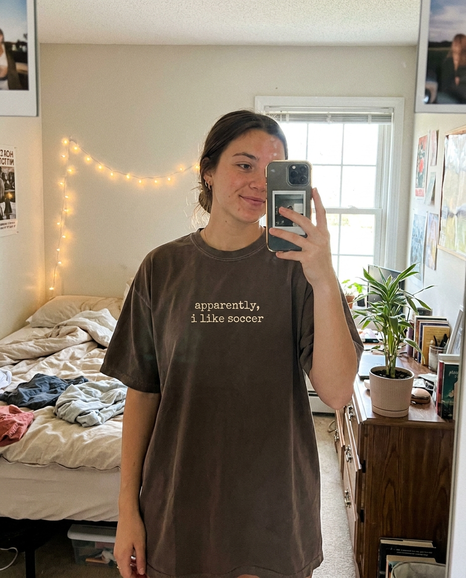 Mirror selfie wearing apparently i like soccer tee