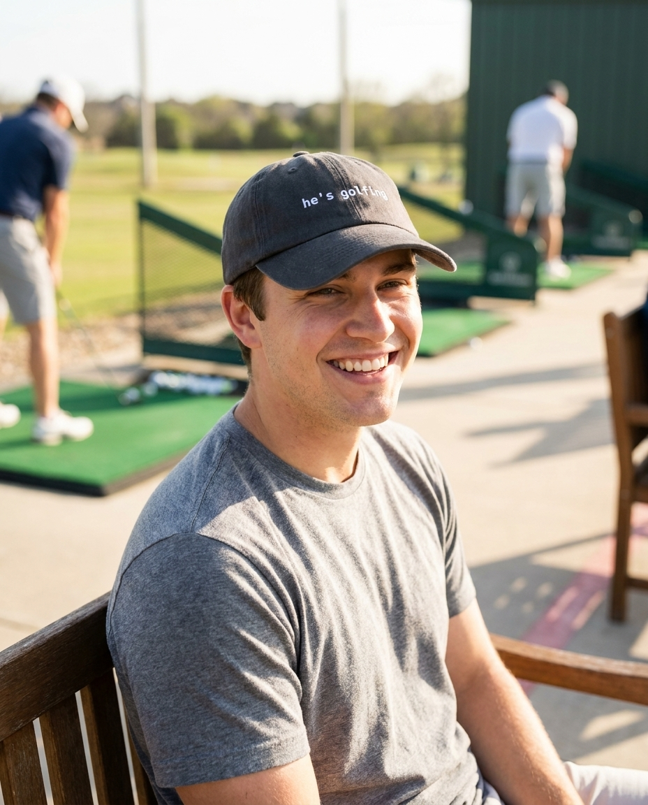 Man wearing the charcoal grey He's Golfing dad hat