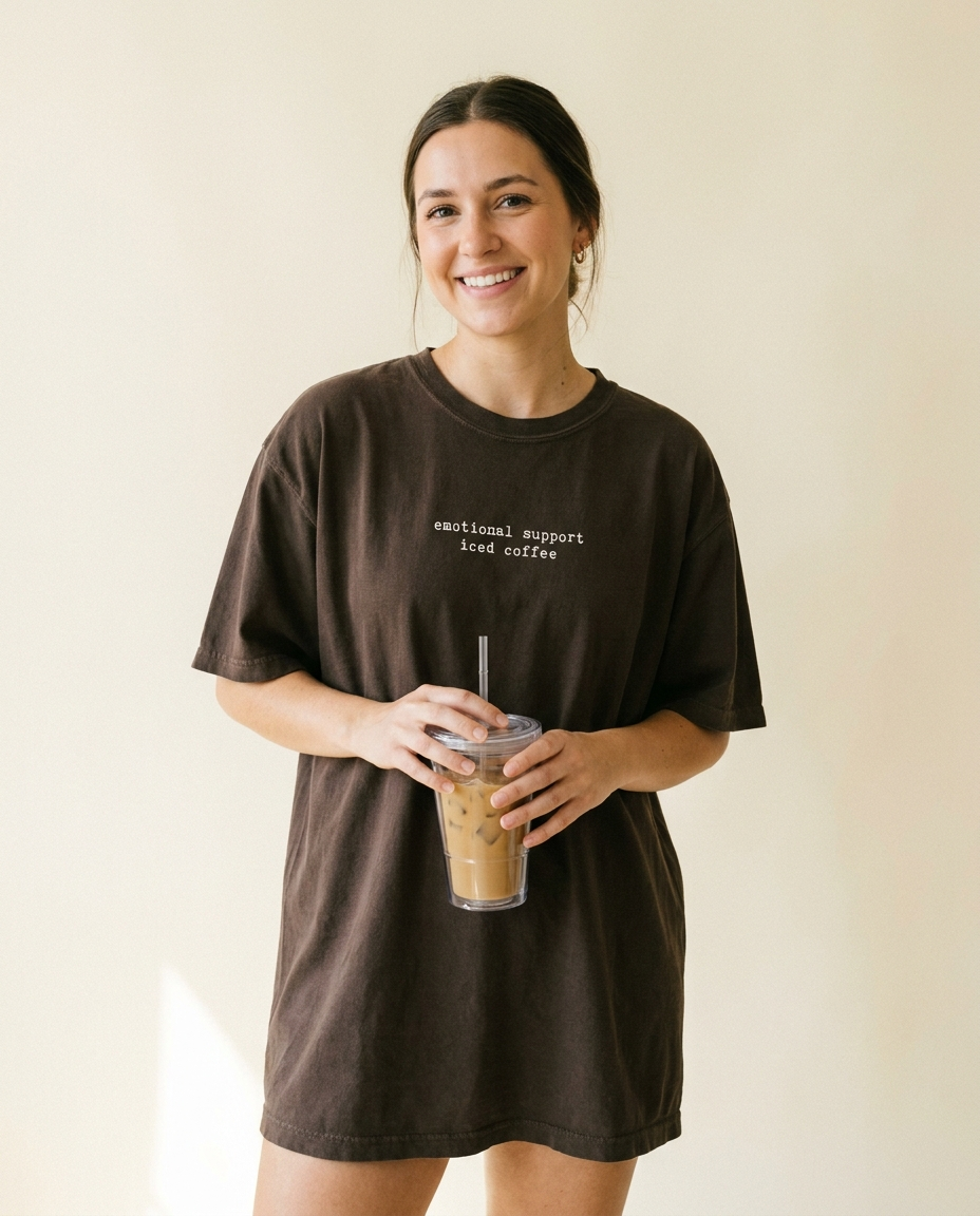 Woman holding iced coffee wearing emotional support iced coffee tee