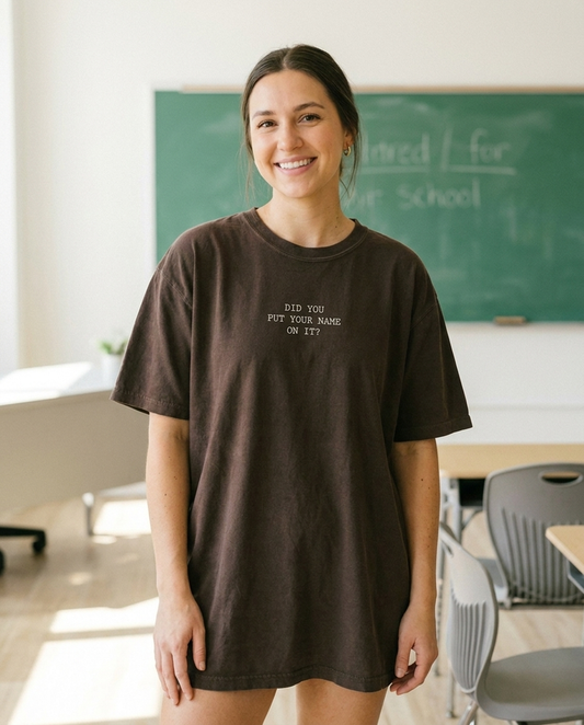 Female teacher wearing Did You Put Your Name On It Comfort Colors tee in a classroom