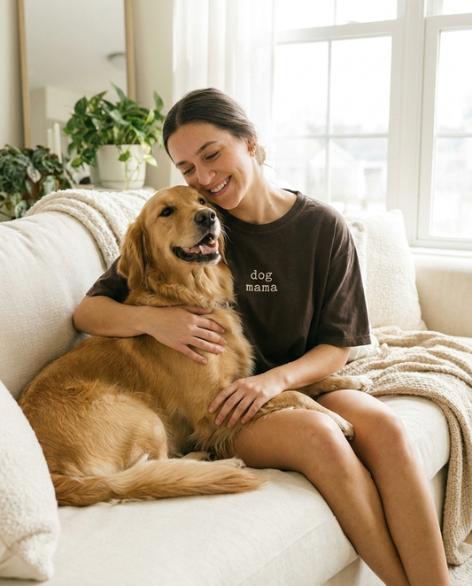 Woman hugging golden retriever wearing espresso dog mama Comfort Colors tee
