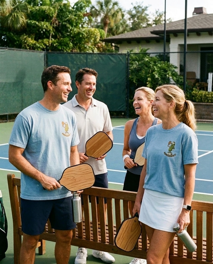 Pickleball club friends wearing Dink Responsibly tees
