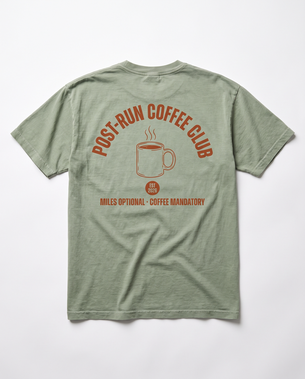 Post-Run Coffee Club tee — terracotta back print on sage Comfort Colors tee, flat lay
