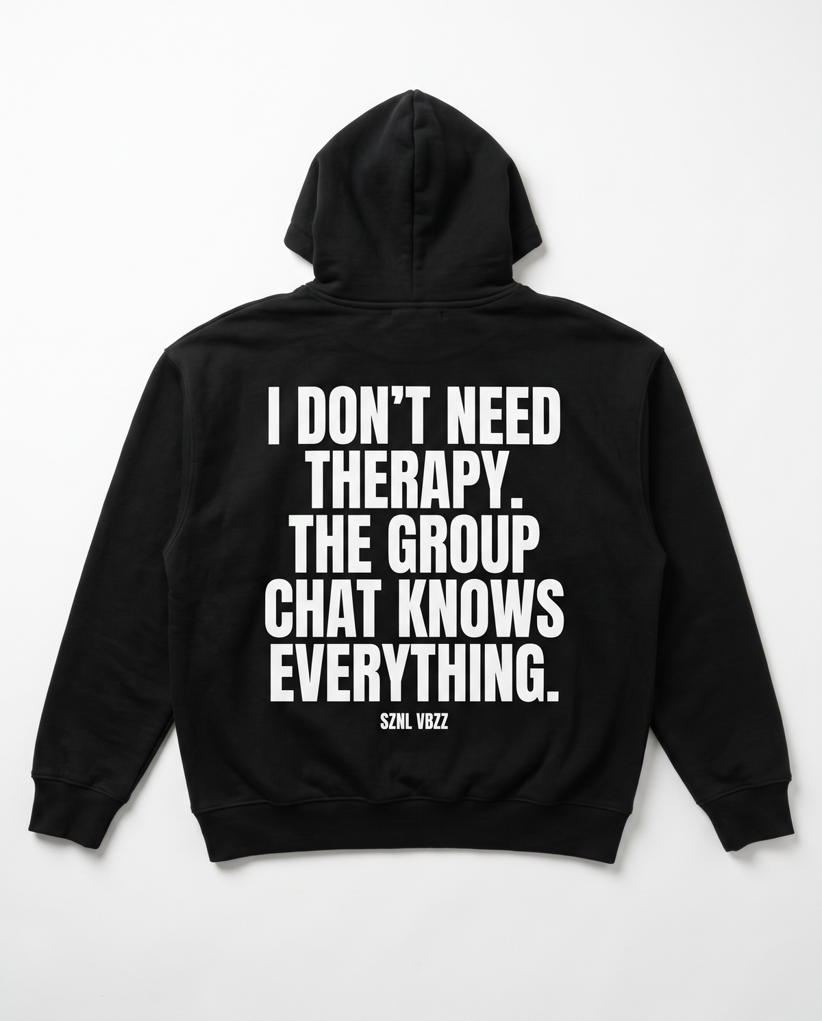 I Don't Need Therapy hoodie — white back print on black heavyweight pullover, flat lay