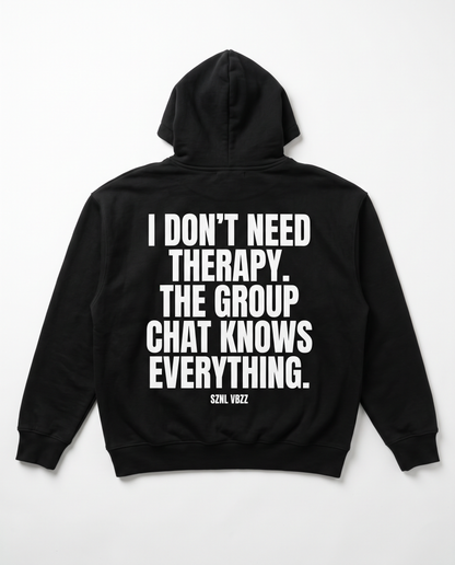 I Don't Need Therapy hoodie — white back print on black heavyweight pullover, flat lay