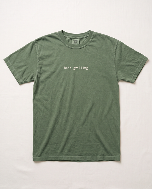 He's Grilling tee, moss green flat lay