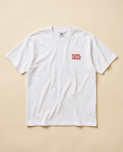 Front of the white tee with small red SZNL VBZZ chest mark, flat lay