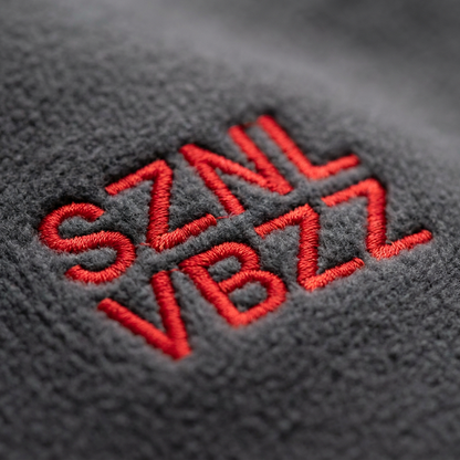 Close-up of the red SZNL VBZZ embroidery stitching
