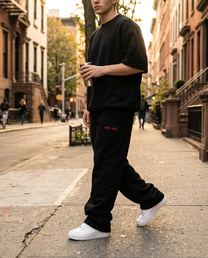Oversized black SZNL VBZZ embroidered sweatpants street style