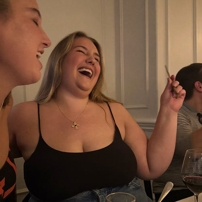 Black seamless bodysuit worn with jeans at dinner